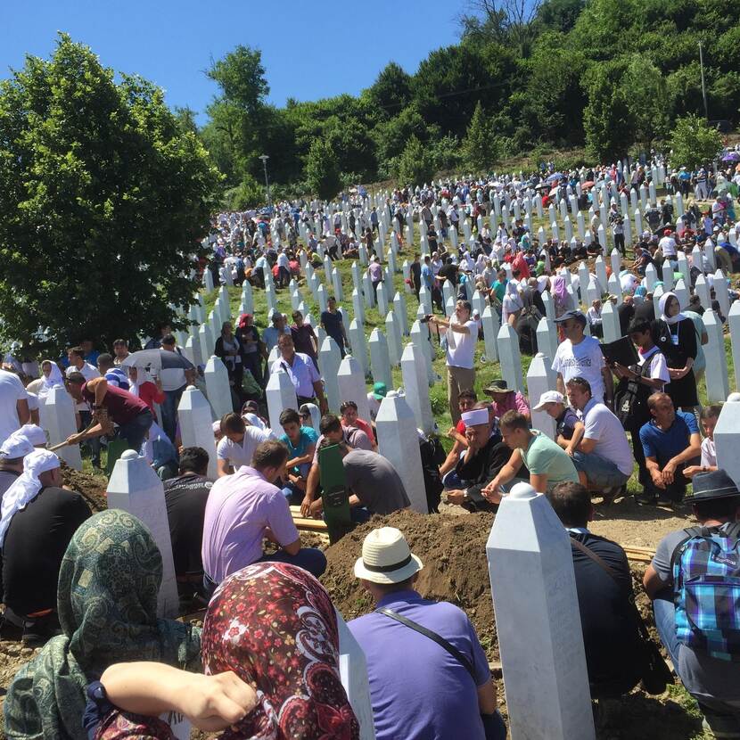 Archive photo of a cemetery in Srebrenica where relatives mourn for boys and men murdered in 1995.