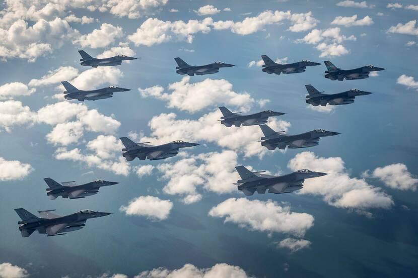 12 flying F-16's in the clouds