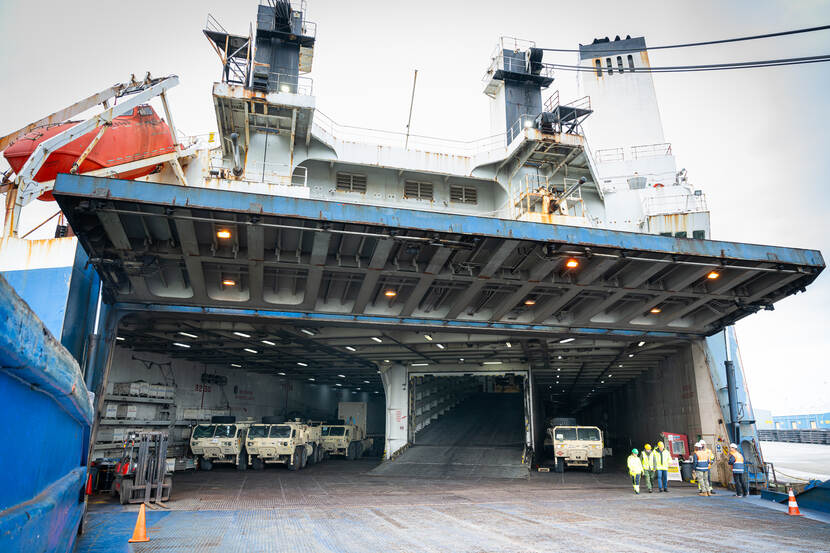 A ship with military equipment us being unloaded