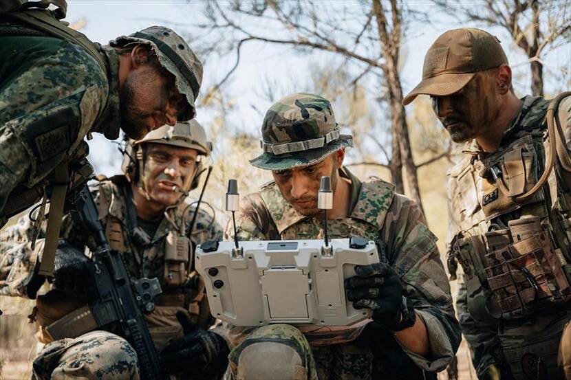 Four soldiers testing new technologies