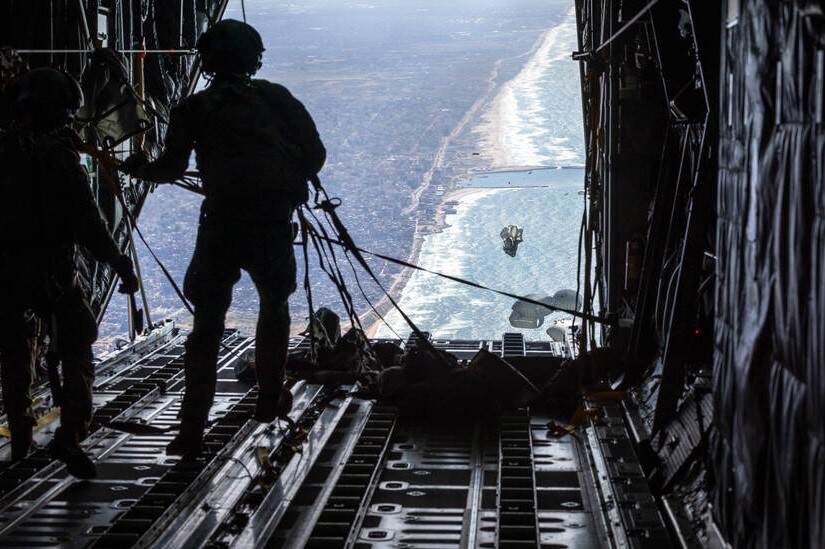 A military makes an aid drop above Gaza.