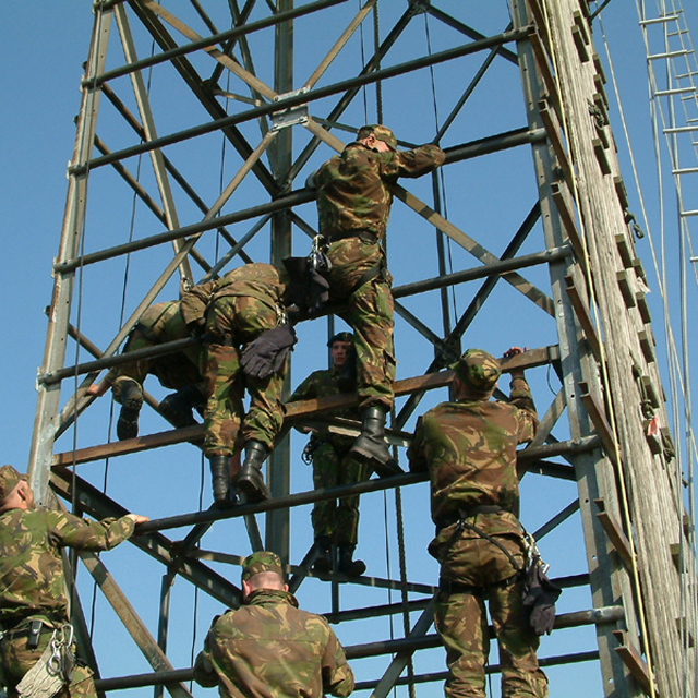 Soldiers on a climbing tower during training.