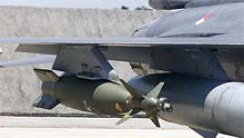 Laser guided bomb on a F-16. Fighter aircraft carry different types of bombs, rockets and a 6-barrel M61A1 Vulcan 20mm canon (F-16) or a 4-barrel GAU-22 25mm Gatling gun (F-35).