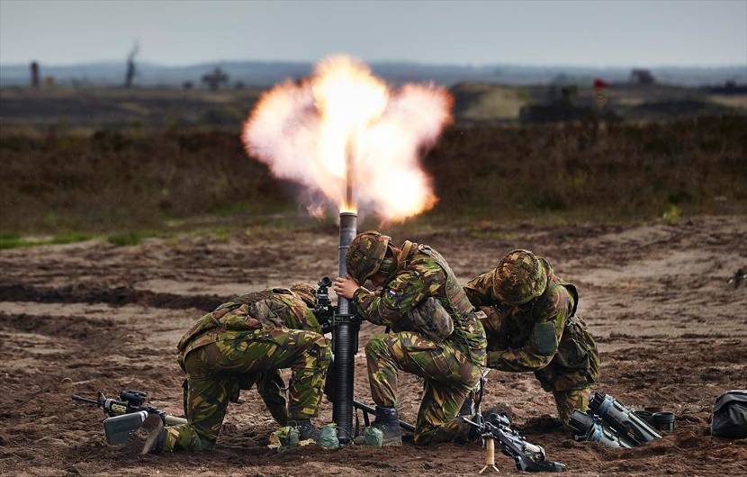 Soldiers fire a 81mm mortar. The Dutch military owns also 60- and 120mm mortars.