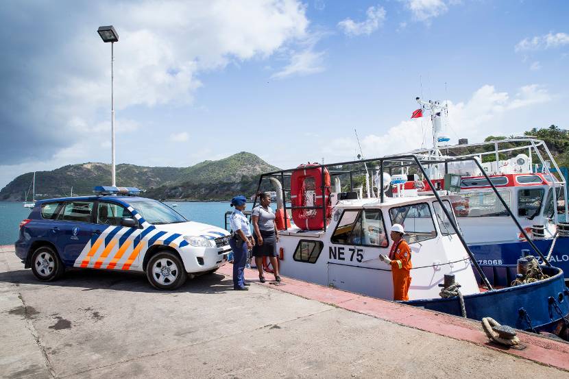 2 RNLM officers in a port in the Caribbean.