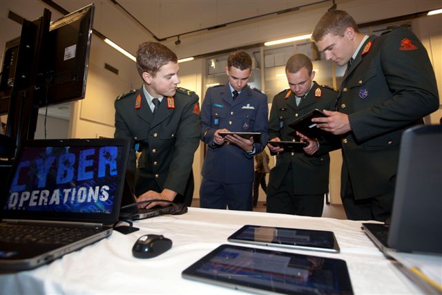 Military with tablets.