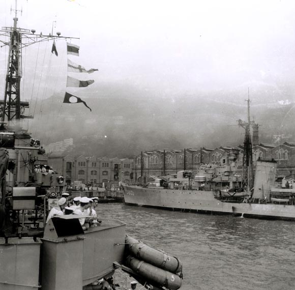 HNLMS Van Galen docks alongside HNLMS Evertsen in Hong Kong harbour.
