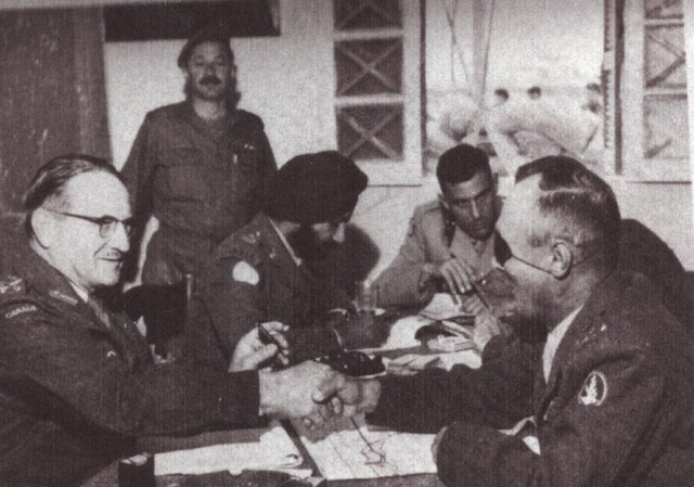 Captain J.A. Bor (at the head of the table) talks about the withdrawal of Israeli soldiers from the Sinai and the exchange of prisoners-of-war. On the right, the Commander-in-Chief of the Israeli forces General Moshe Dayan, on the left the commander of UNEF-I, Major General E.L.M. Burns.