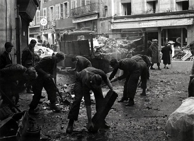 Dutch soldiers clearing debris from the streets of Aubusson.