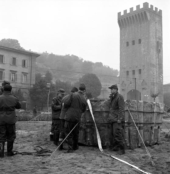 Members of the Disaster Relief Corps at work at Piazza Guiseppe Poggi with the Poggi tower in the background.