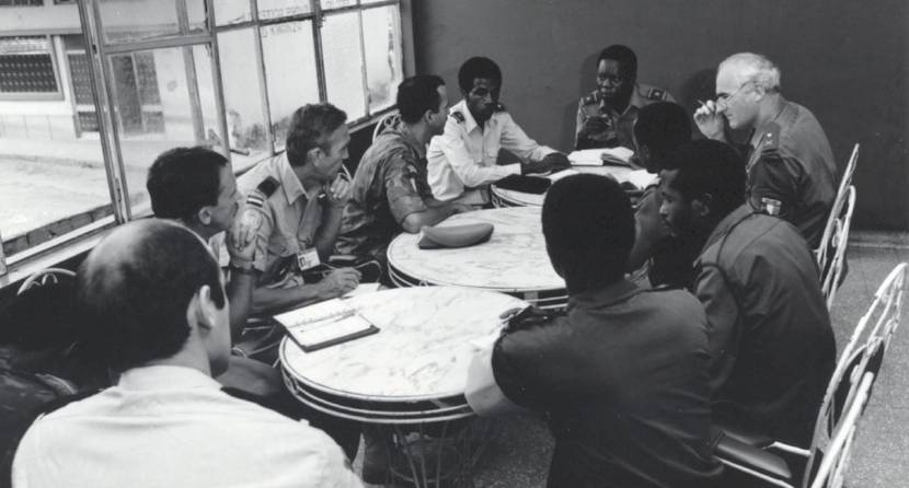 Captain R. de Bruin (left centre) consults with members of the international observers team for Angola in N'dalatando in January 1992.