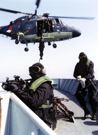 A Lynx helicopter lands marines tasked with securing a ship as part of an exercise in September 1994.