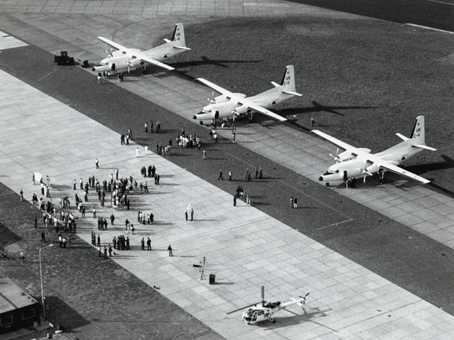 F-27 Troopships and an Alouette III helicopter are lined up ready for departure to Cambodia in late May 1992.