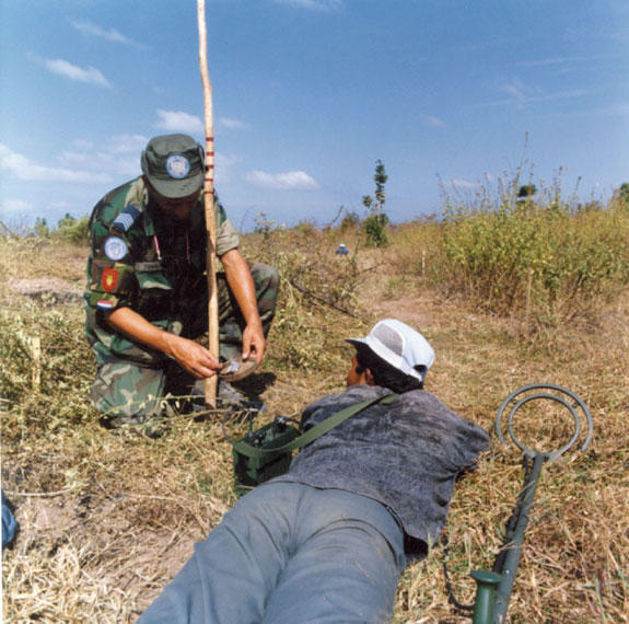 Sergeant Major J.H. Timmerman instructing a Cambodian mine-clearance trainee.