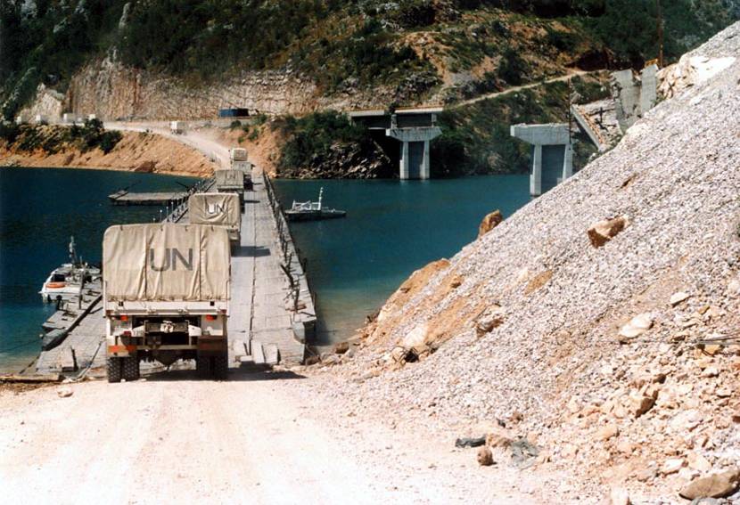 One of the transport battalion’s humanitarian convoys crosses a ribbon bridge over the River Neretva near Mostar in August 1994.