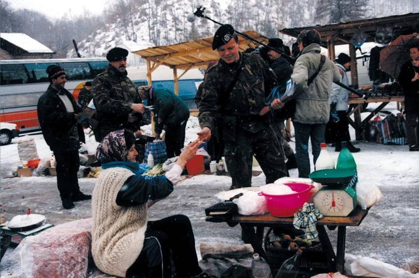 Hussar 1 N.C.W. Jansen and Sergeant 1 R. Itsch hand out editions of the ‘Mostovi’ magazine to locals during the SFOR Information Campaign, early 2000.