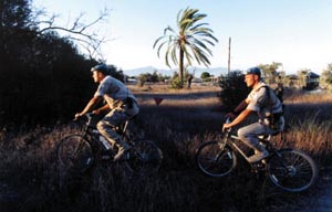 2 servicemen from the airmobile brigade patrol by bicycle, July 1998.