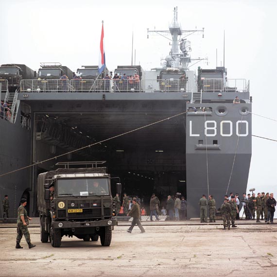 A convoy in Durrës ready for departure to Korcë in May 1999. The marines provide security for the Royal Netherlands Army trucks.