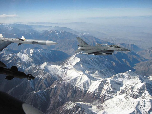 2 Royal Netherlands Air Force F-16 MLU fighters over the snow-covered mountains of Tajikistan.