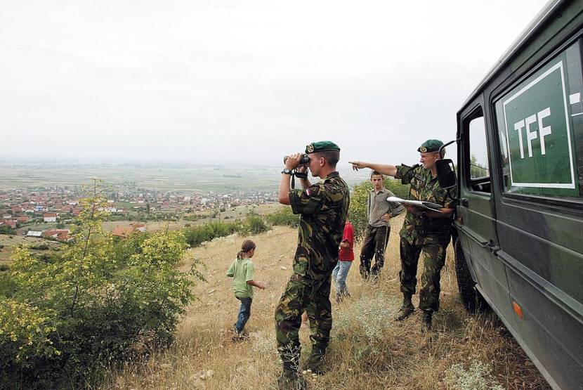 2 members of the Skopje field liaison team (Task Force Fox) in action.