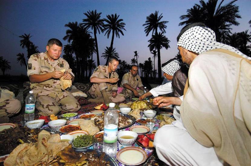 Lieutenant Colonel R.H. van Harskamp and Lieutenant Colonel C.J. Matthijssen, the commanders of SFIR-3 and SFIR-4 respectively, were invited to dine with a local sheik.
