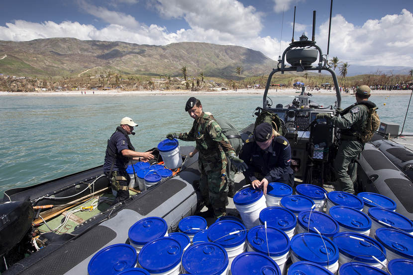 Buckets containing products for personal hygiene, such as soap and toilet paper, being taken ashore.